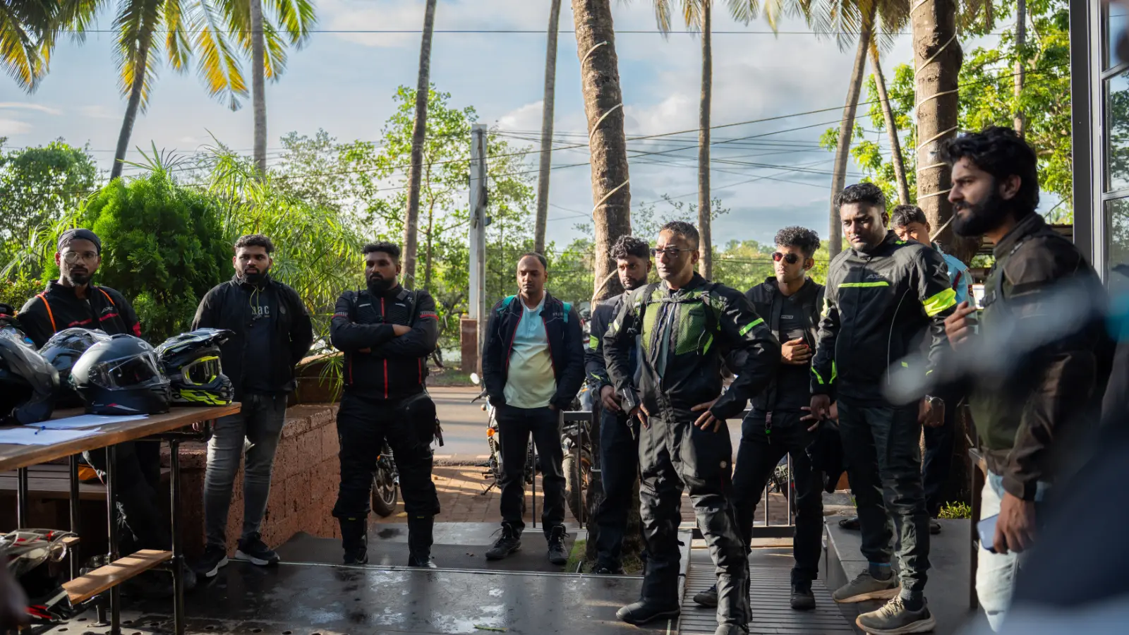 Riders gather for the pre ride briefing before setting off on a group motorcycle ride through Goa.