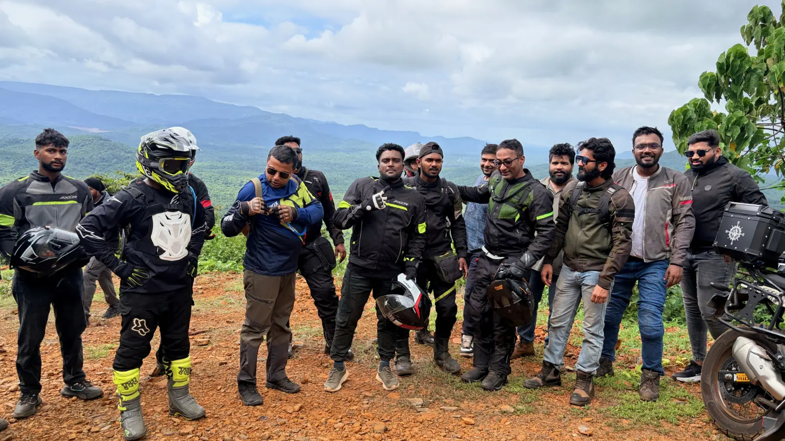 Riders pause at a scenic viewpoint in the Western Ghats during a group adventure ride.