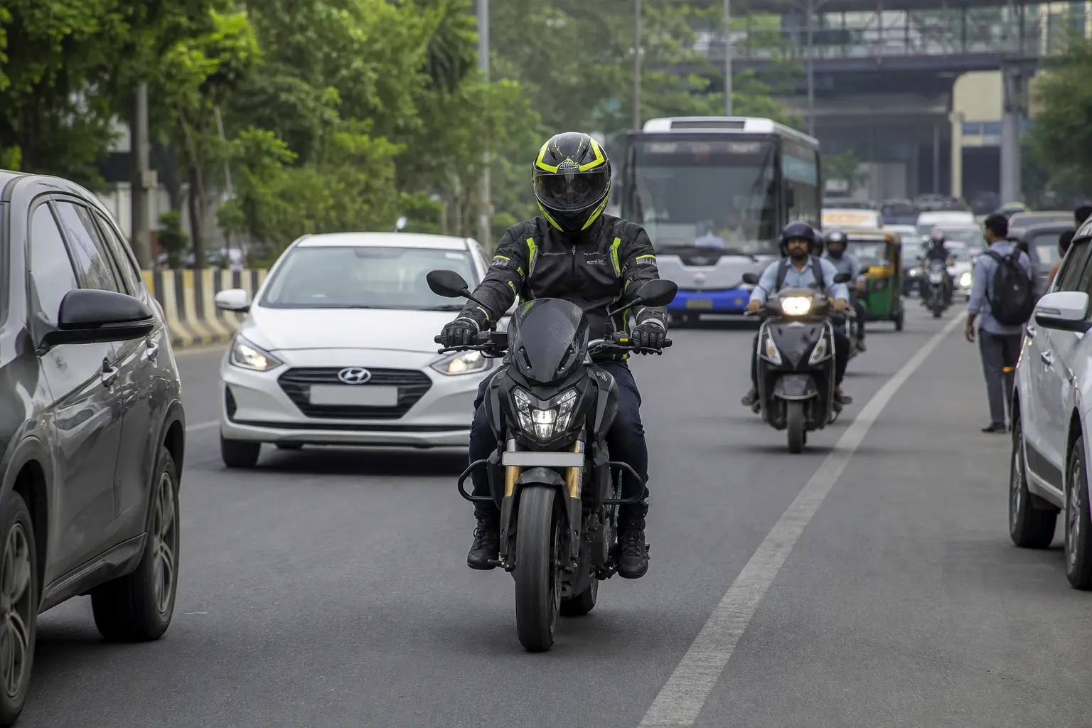 Motorcyclist using lane position to stay visible in mixed traffic