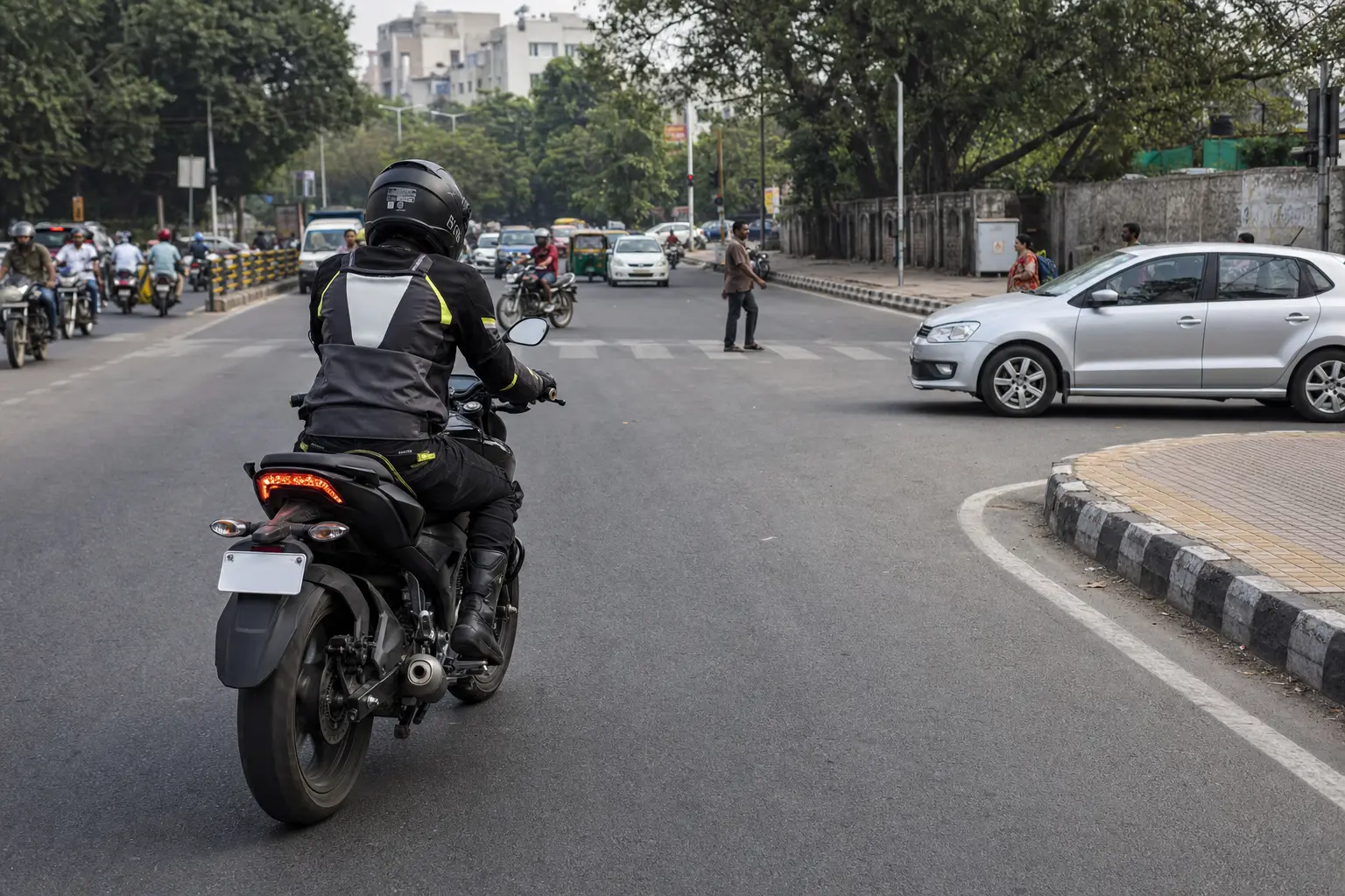 Motorcyclist leaving a clear gap near a junction