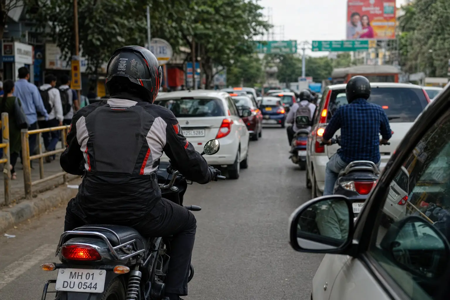 Motorcyclist scanning busy traffic ahead for developing hazards