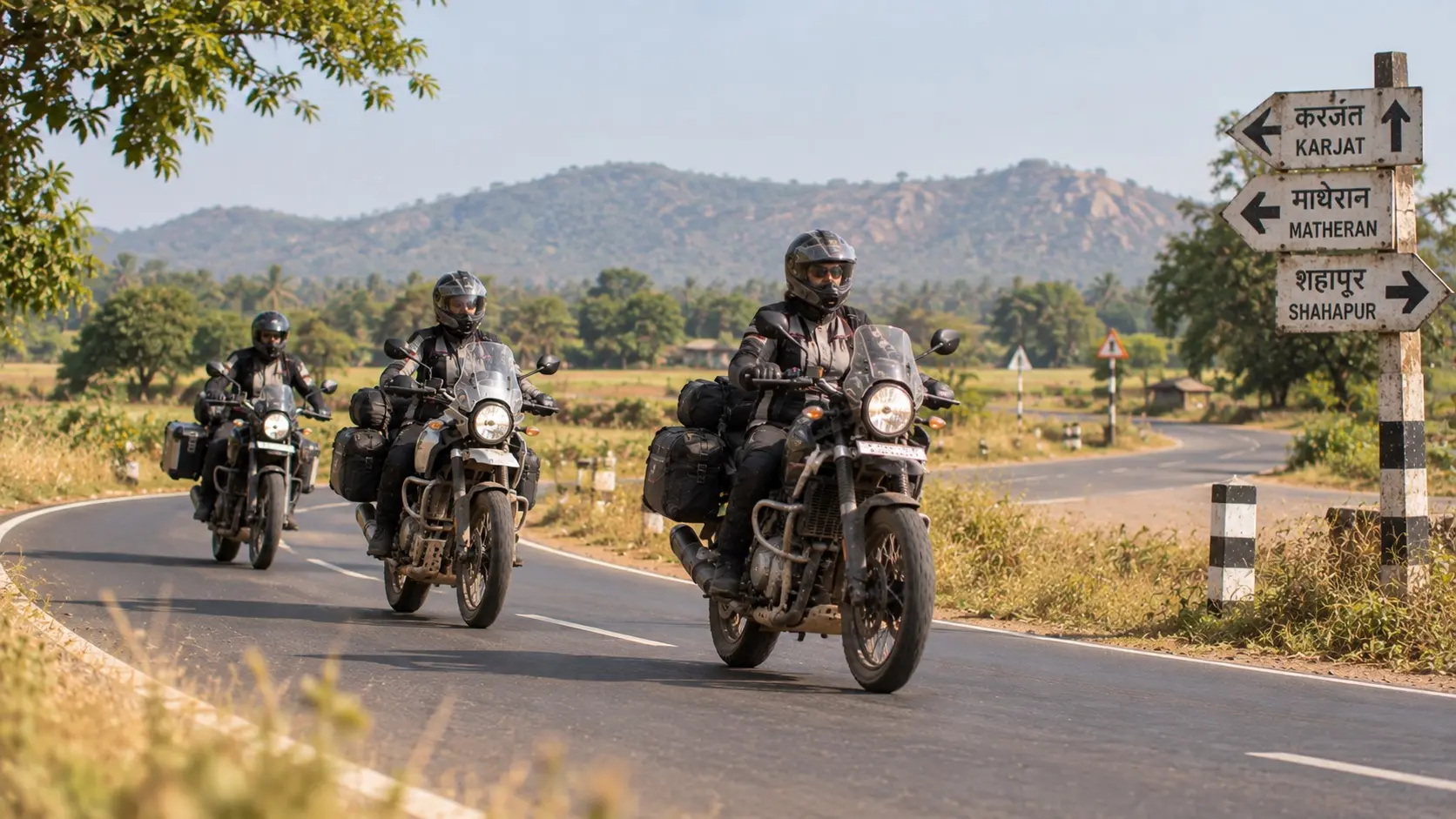 A small group of riders checking a route beside their parked motorcycles