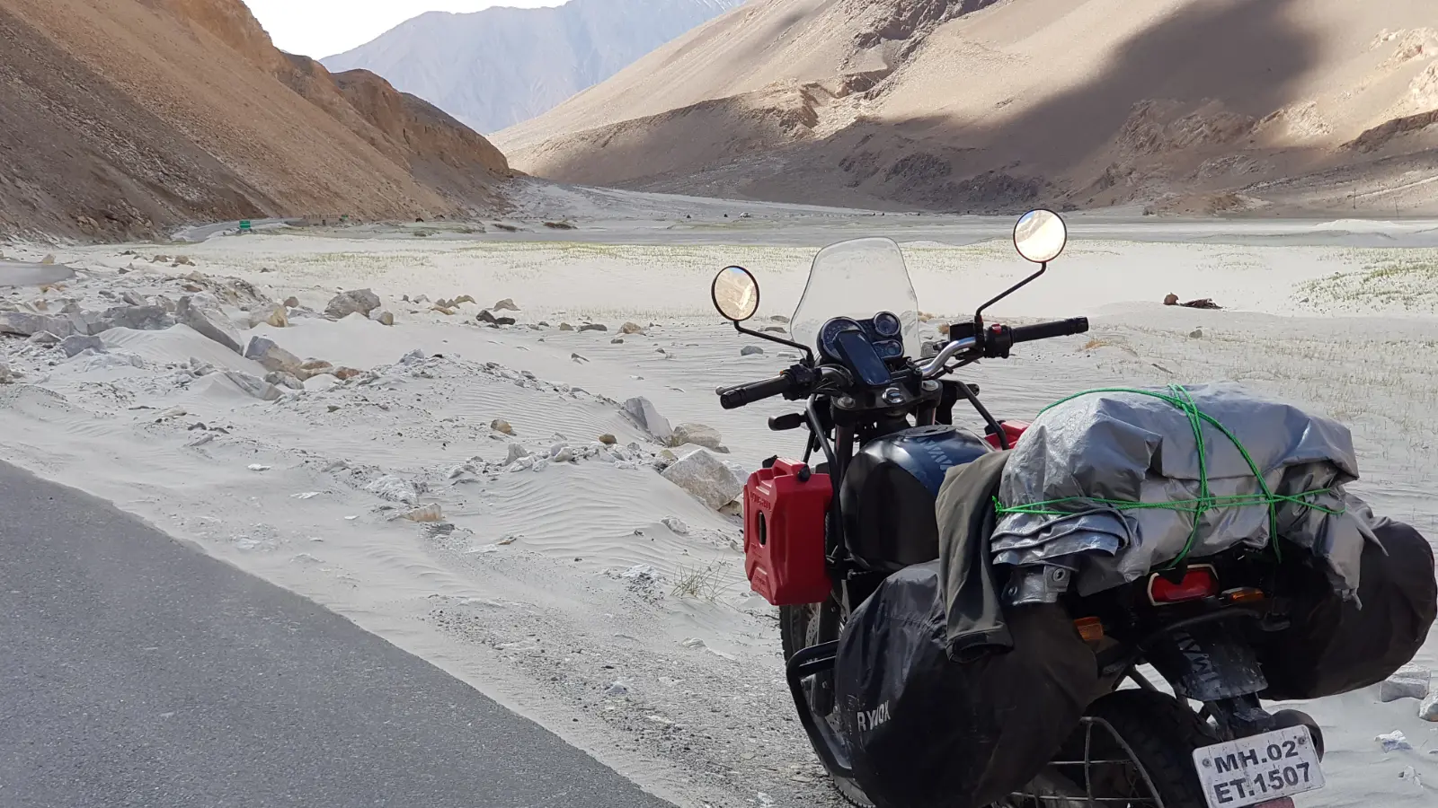 Royal Enfield Himalayan crossing the landscape around Drass
