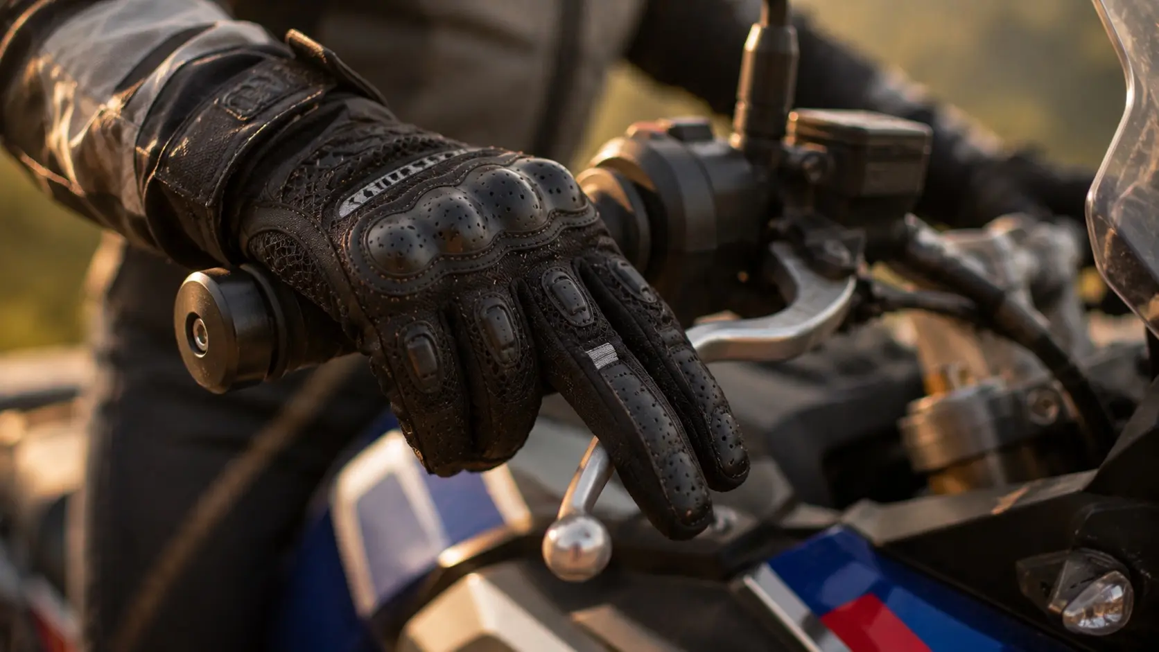 Motorcyclist carefully putting on a riding glove before starting a journey