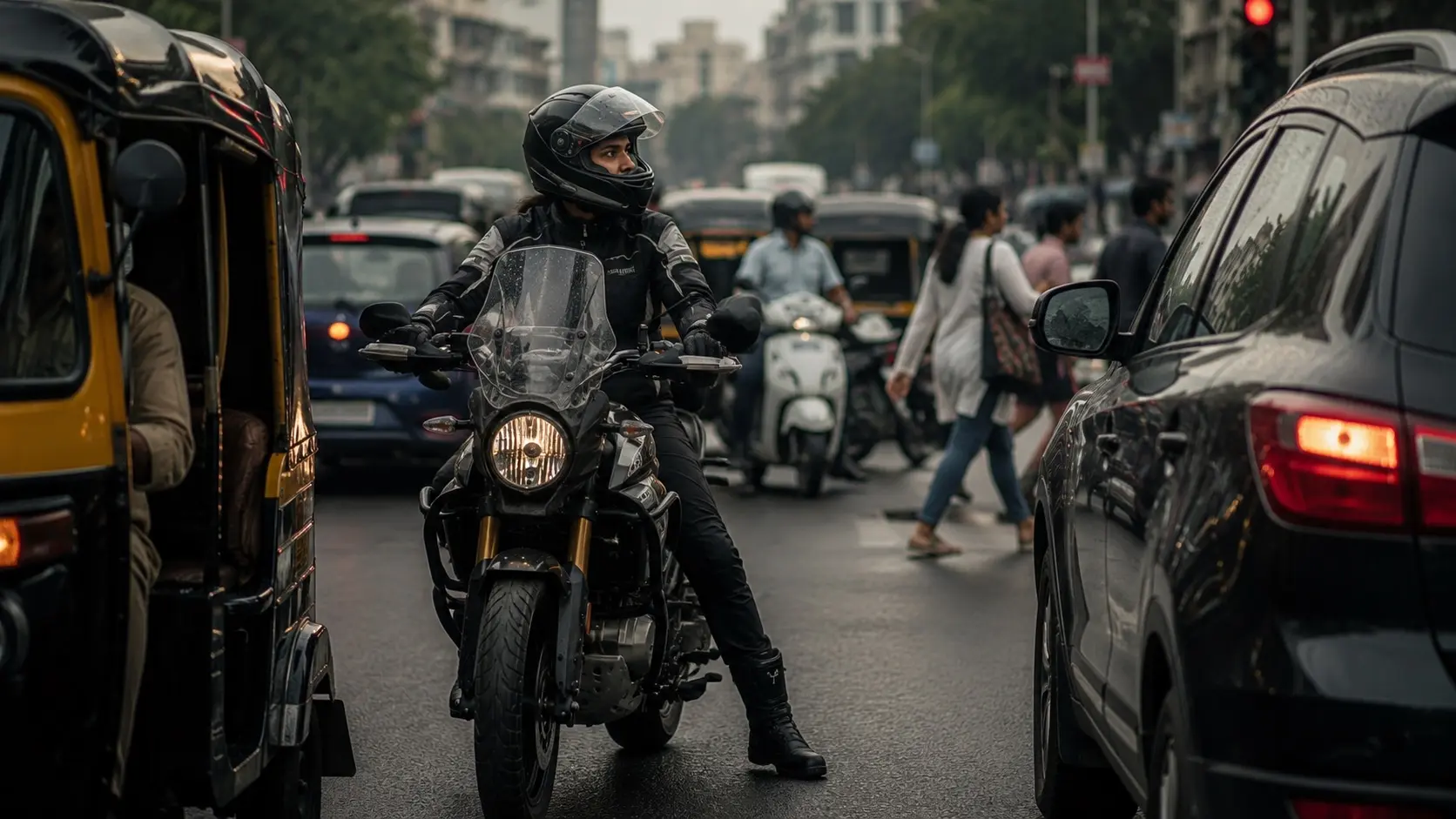 Motorcyclist waiting calmly at a crowded city traffic signal